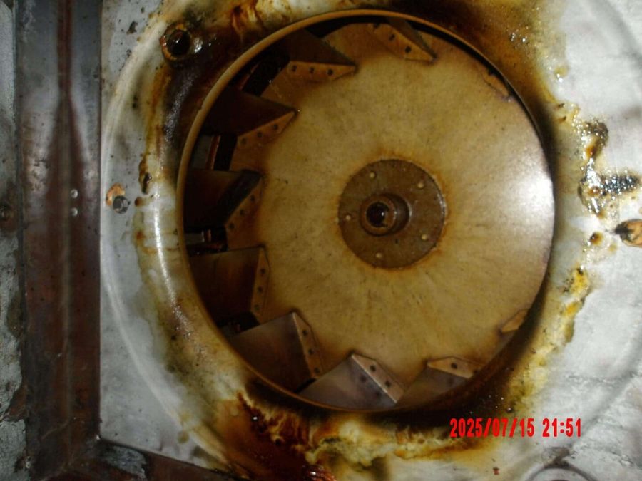 Grease-caked rooftop fan before cleaning by Oregon Hood Cleaning