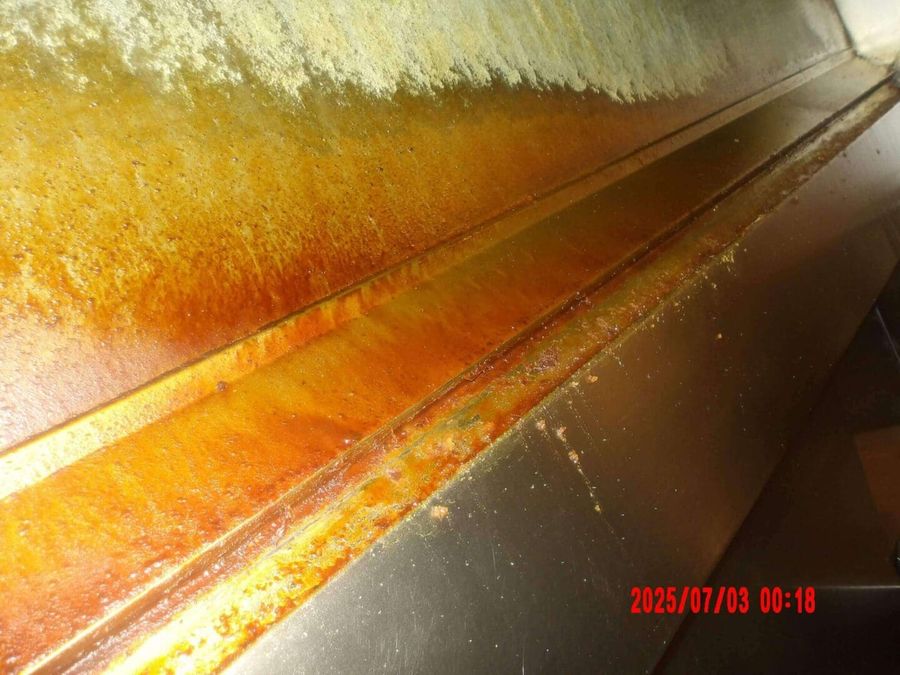 Grease-caked inside the hood before cleaning by Oregon Hood Cleaning
