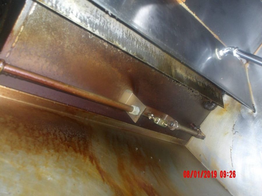 Grease-caked plenum before cleaning by Oregon Hood Cleaning